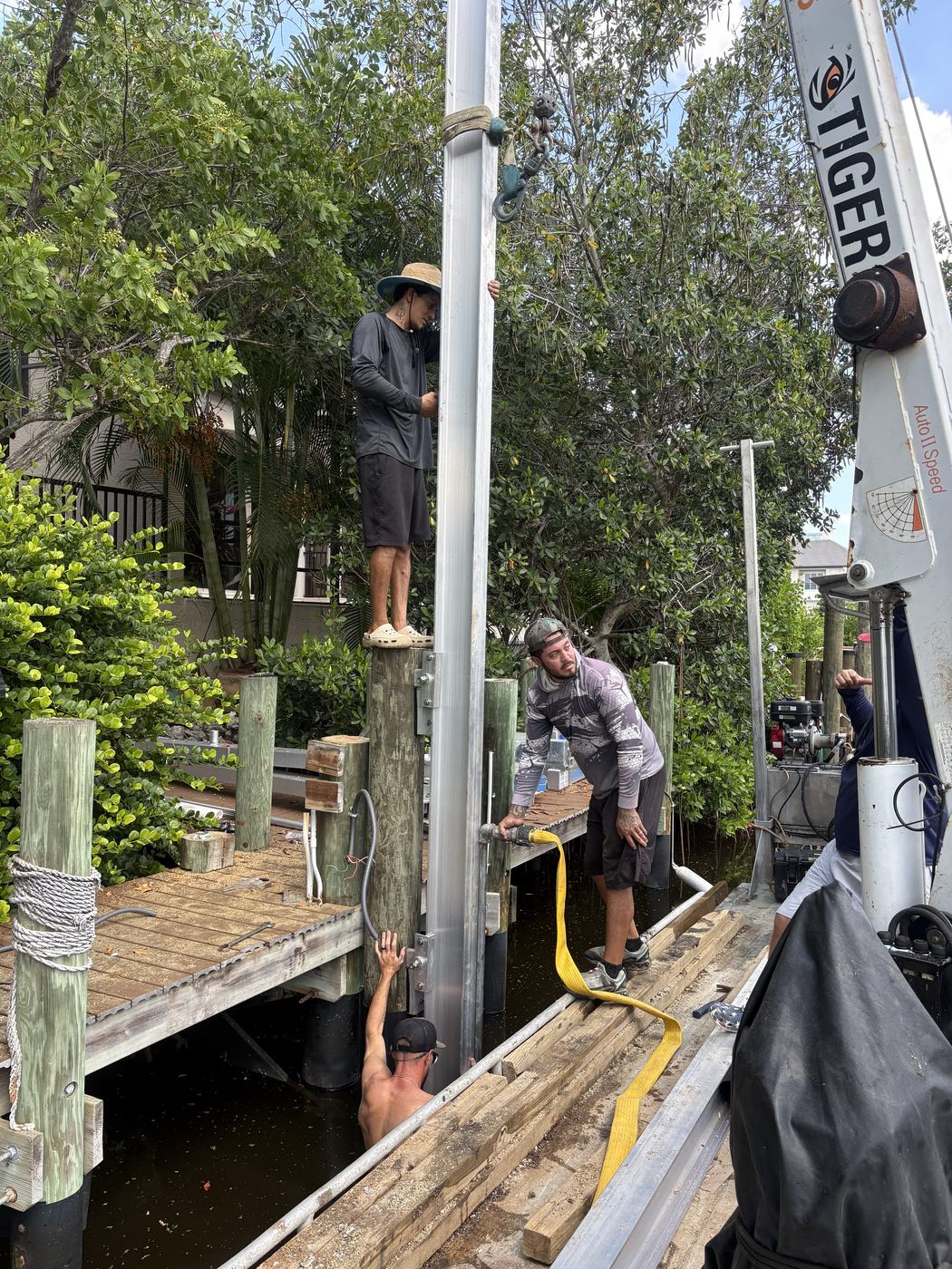 The crew working a lift from the barge